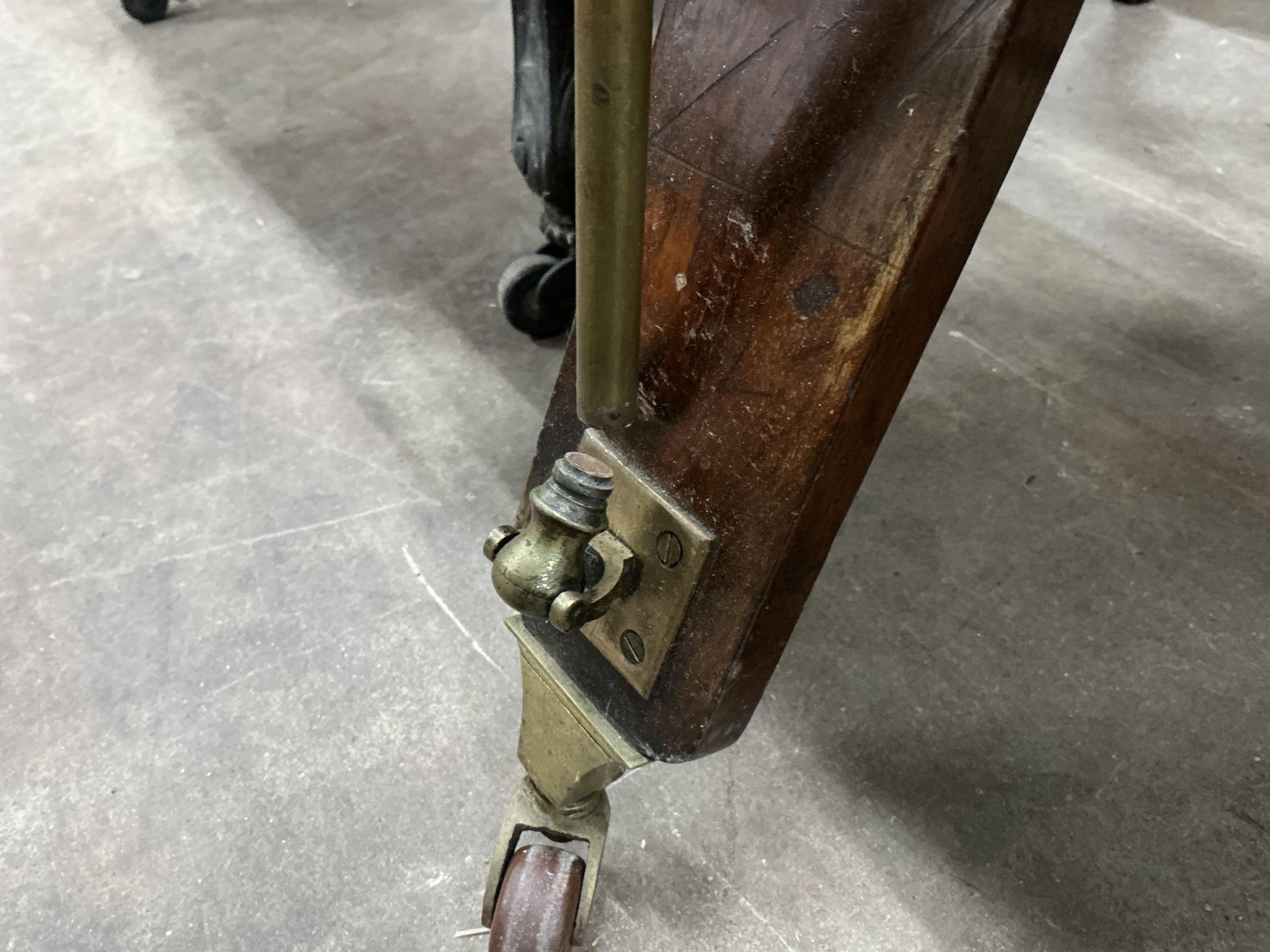 A Victorian brass mounted green morocco folio stand, width 82cm, height 90cm